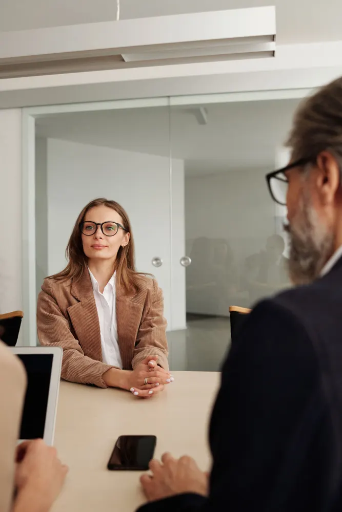 Business advisers discussing a plan across a table